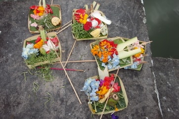 colourful flowers decorate a Bali shrine